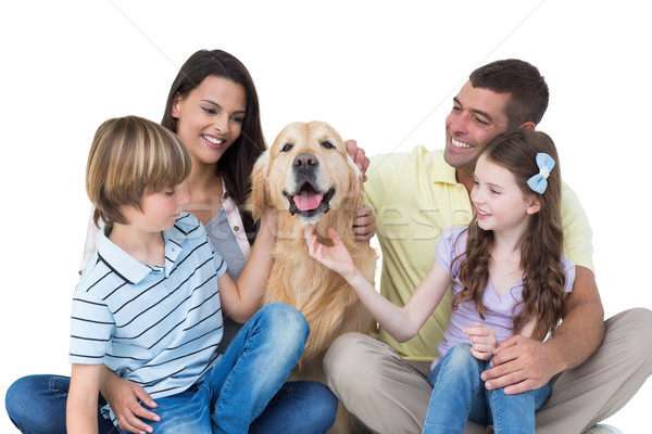 Family stroking dog Stock photo © wavebreak_media