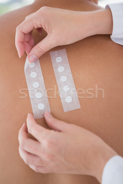 Stock photo: Doctor doing skin test to her patient 