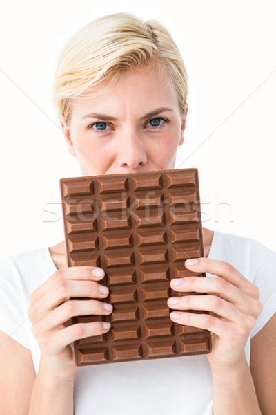 Attractive woman holding big bar of chocolate Stock photo © wavebreak_media
