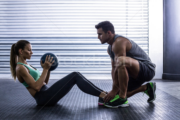Muscular couple doing abdominal ball exercise Stock photo © wavebreak_media