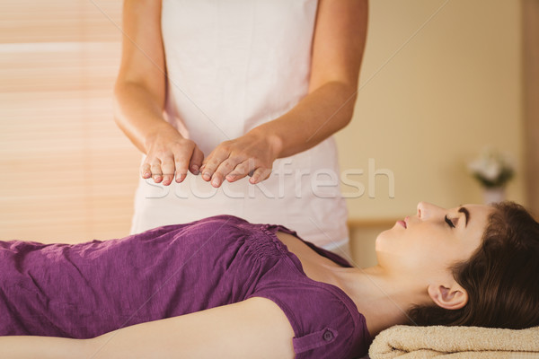Stock photo: Young woman having a reiki treatment