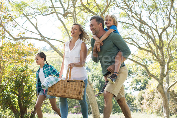 Family arriving in the park for picnic on a sunny day Stock photo © wavebreak_media