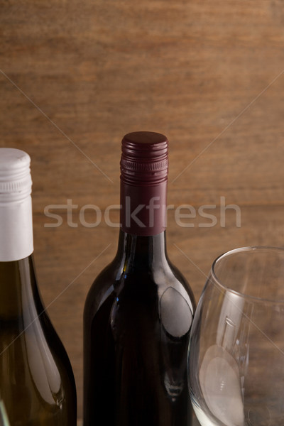 Cropped image of wineglass by bottles Stock photo © wavebreak_media