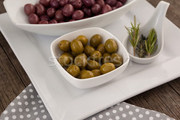 Vert brun olives bols romarin plaque [[stock_photo]] © wavebreak_media