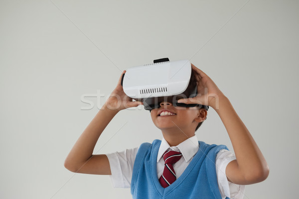 Schoolboy using virtual reality headset Stock photo © wavebreak_media