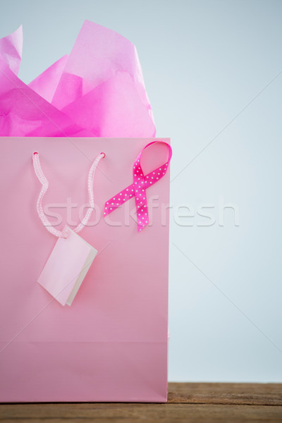 Close-up of pink spotted Breast Cancer Awareness ribbon on shopping bag Stock photo © wavebreak_media