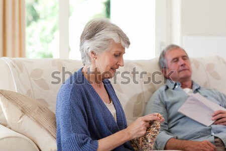 Senior man looking at doctor adjusting bed while sitting on wheelchair Stock photo © wavebreak_media