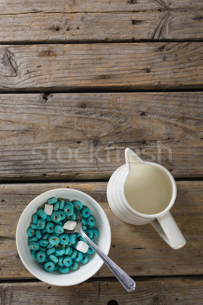 Bowl of froot loops and marshmallow with milk jug Stock photo © wavebreak_media