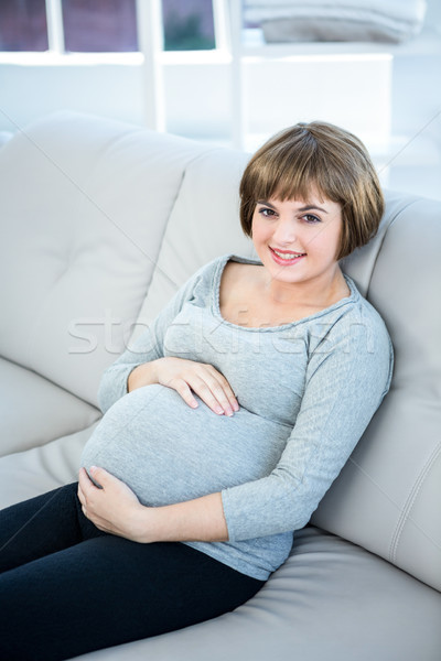 Magasról fotózva kilátás mosolyog terhes nő ül otthon Stock fotó © wavebreak_media
