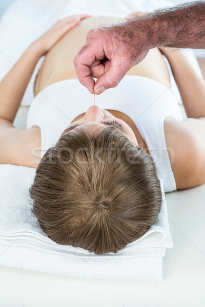 Therapist performing reiki over pregnant woman Stock photo © wavebreak_media