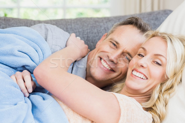 Cute couple napping on the couch Stock photo © wavebreak_media