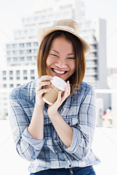 Young woman holding disposable cup Stock photo © wavebreak_media