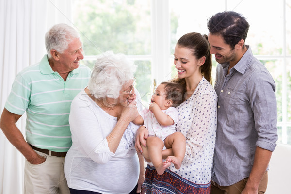 Souriant famille jouer bébé maison homme [[stock_photo]] © wavebreak_media