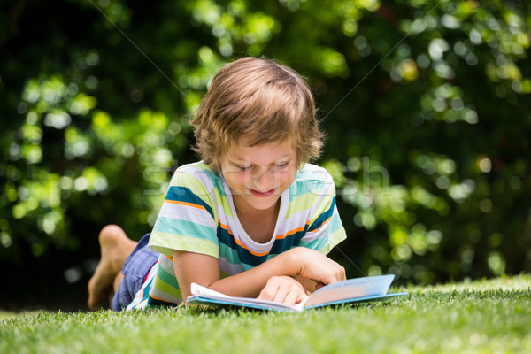 A little boy is reading a book Stock photo © wavebreak_media