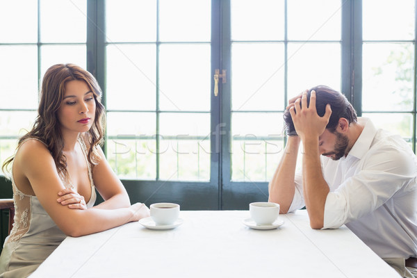 Deprimido Pareja sesión taza de café restaurante hombre Foto stock © wavebreak_media