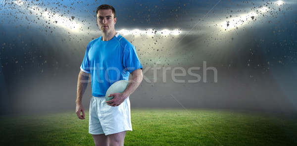 Composite image of rugby player holding a rugby ball Stock photo © wavebreak_media