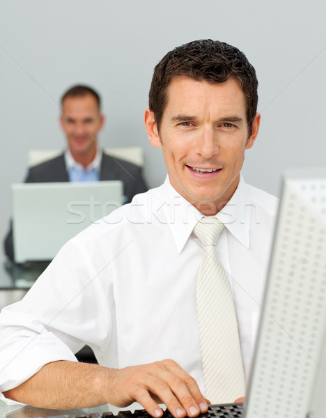 Confident businessman working at his computer  Stock photo © wavebreak_media