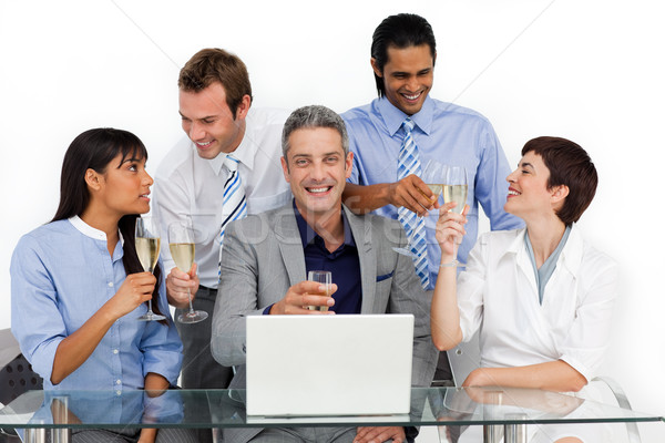 Cheerful business team toasting with Champagne  Stock photo © wavebreak_media