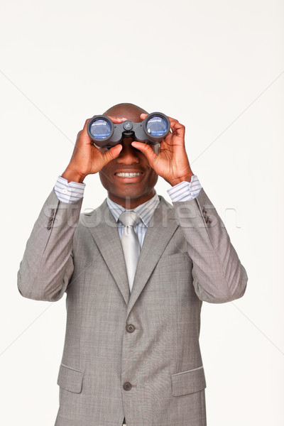 Afro-American businessman looking through binoculars Stock photo © wavebreak_media