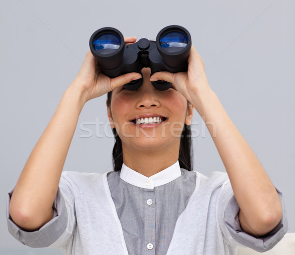 Mujer de negocios mirando binoculares oficina cara fondo Foto stock © wavebreak_media