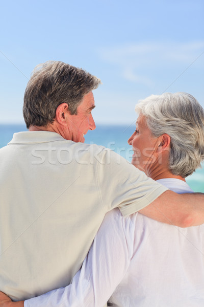 Pareja de ancianos mirando mar feliz caminando femenino Foto stock © wavebreak_media