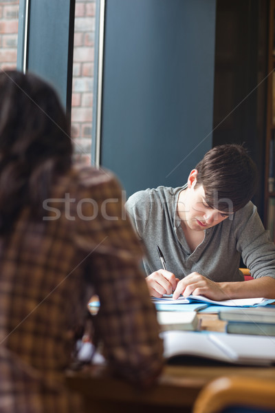 Retrato estudiante escrito ensayo biblioteca escuela Foto stock © wavebreak_media