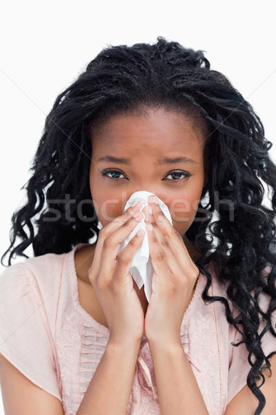 A close up shot of a woman blowing her nose in a tissue Stock photo © wavebreak_media