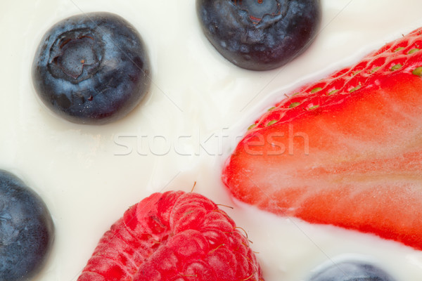Slice berries on the cream in a high angle shot Stock photo © wavebreak_media