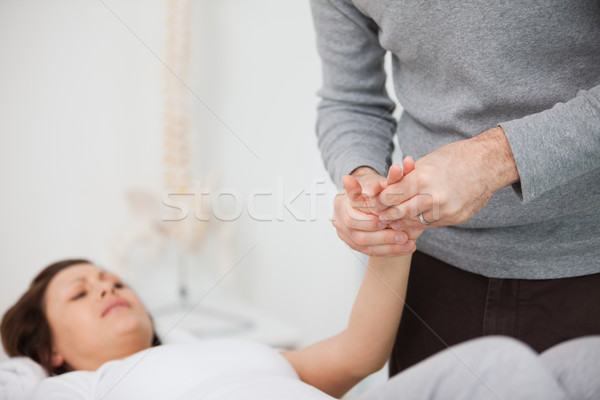 Physiotherapist massaging a painful hand indoors Stock photo © wavebreak_media