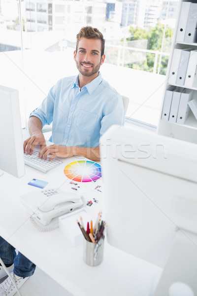 Smiling male photo editor using computer Stock photo © wavebreak_media