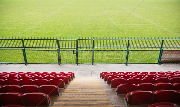 Red bleachers looking down on football pitch Stock photo © wavebreak_media