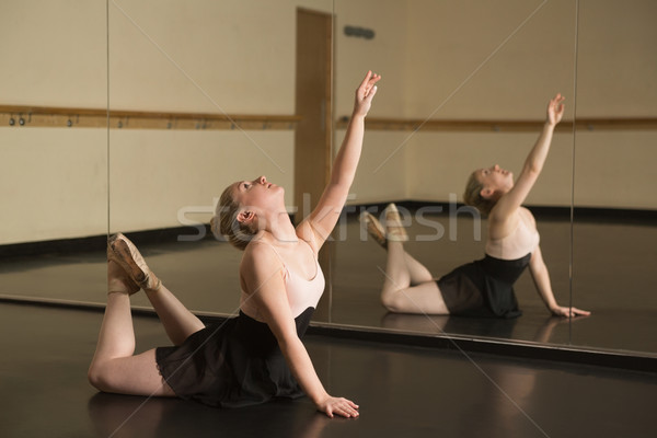 Beautiful ballerina dancing in front of mirror Stock photo © wavebreak_media