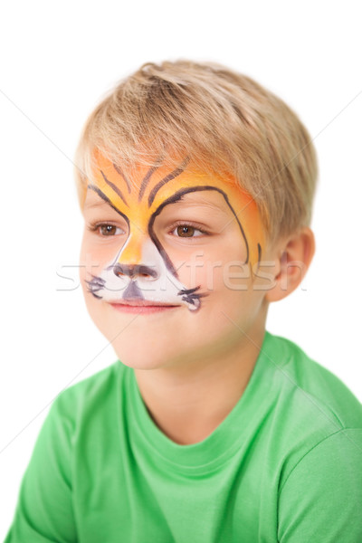 Happy little boy in tiger face paint  Stock photo © wavebreak_media