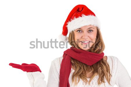 Stock photo: Festive blonde presenting with hand
