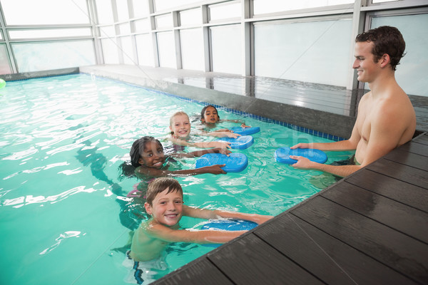 Cute natation classe piscine coach loisirs Photo stock © wavebreak_media