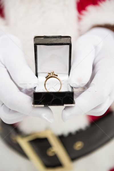 Close up of santa showing engagement ring Stock photo © wavebreak_media