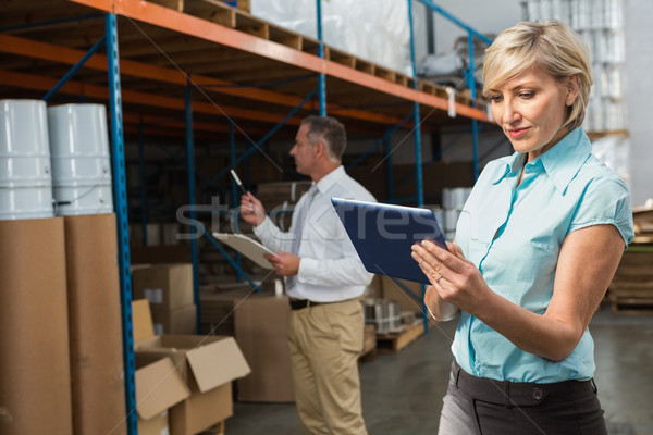 Pretty warehouse manager using tablet pc Stock photo © wavebreak_media