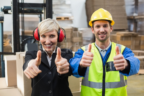 Warehouse worker and his manager giving thumbs up Stock photo © wavebreak_media
