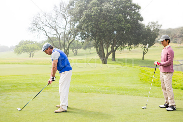 Golfista club amico dietro campo da golf sport Foto d'archivio © wavebreak_media
