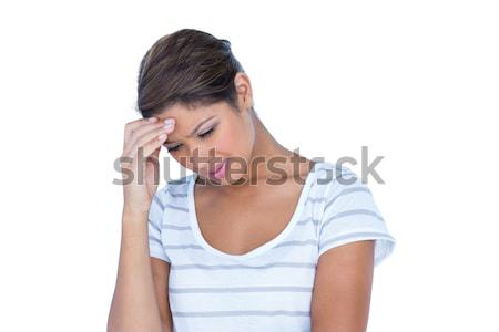 A sad brunette with headache Stock photo © wavebreak_media