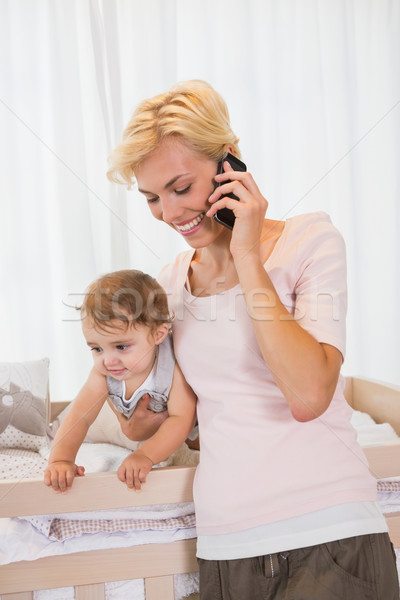 Smiling blonde woman with his son phoning  Stock photo © wavebreak_media