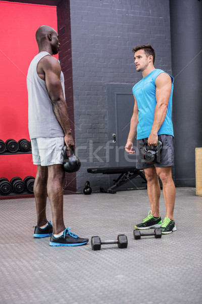 Dois jovem musculação olhando outro ginásio Foto stock © wavebreak_media