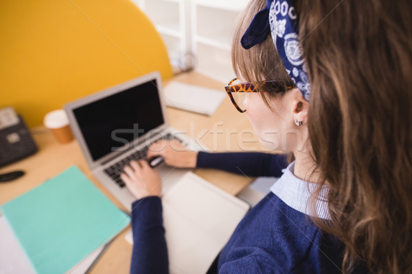 High angle view of businesswoman working at desk in office Stock photo © wavebreak_media
