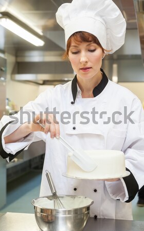 Female chef washing hands in the commercial kitchen Stock photo © wavebreak_media