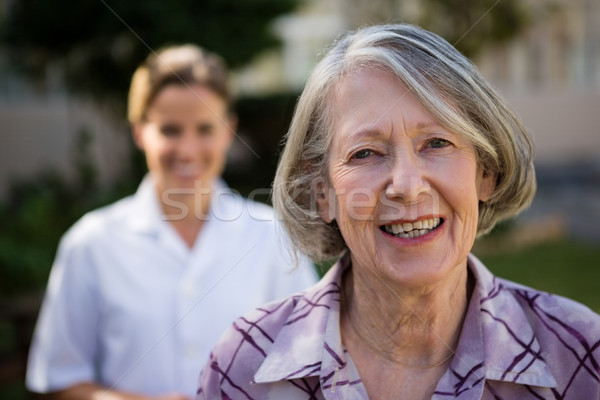 Stock photo: Portrait of senior woman with doctor at park