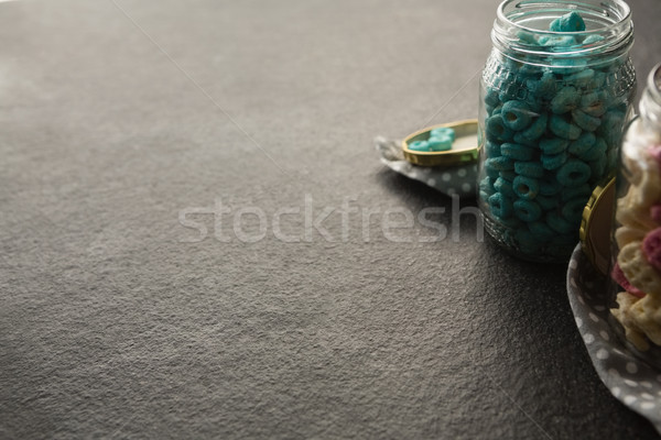 Cereal rings in jar on black background Stock photo © wavebreak_media