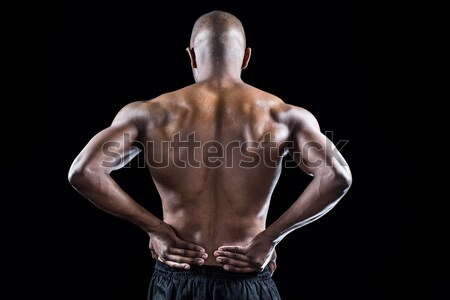 Rear view of athlete stretching with hand on hip Stock photo © wavebreak_media