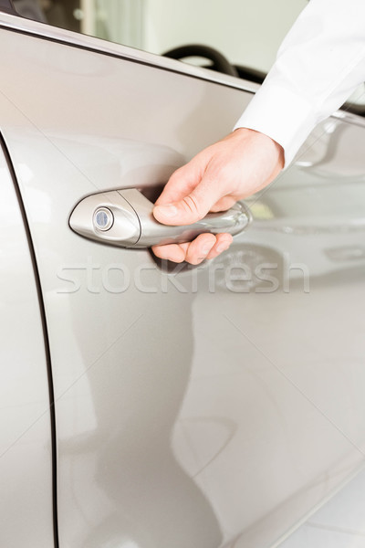 Homme voiture porte nouvelle voiture salle d'exposition [[stock_photo]] © wavebreak_media