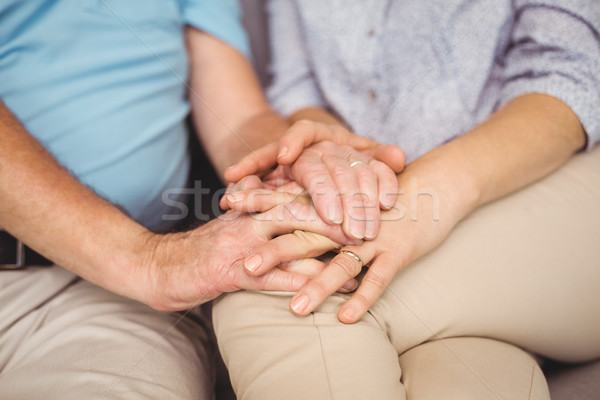 Midsection of couple holding hands Stock photo © wavebreak_media