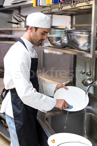 Handsome employee doing dishes Stock photo © wavebreak_media